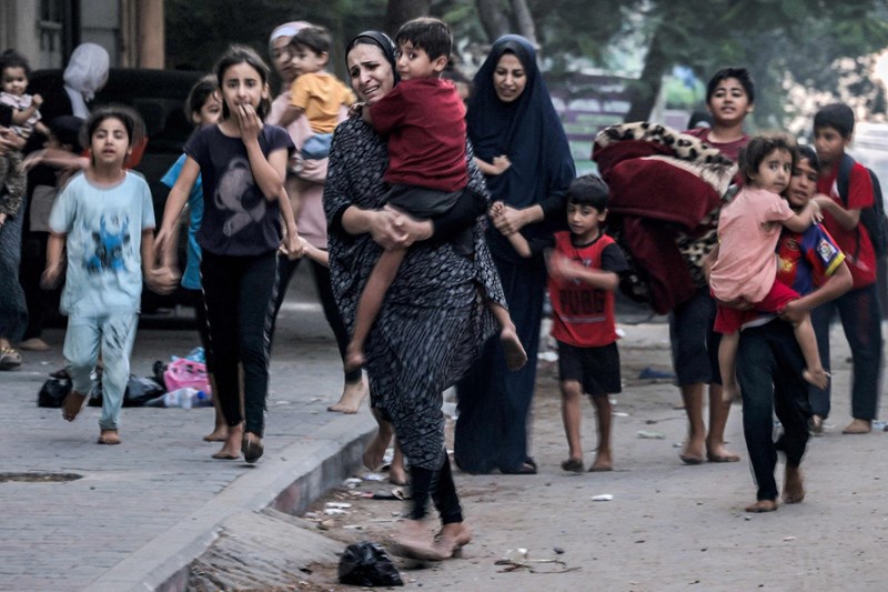 Photo of Palestinian women and children fleeing